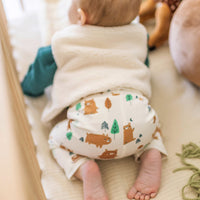 Cream evolutive pants with all over print, newborn