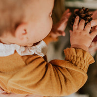 CARAMEL LOOSE FIT BODYSUIT IN TERRY, BABY