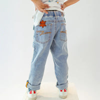 Pale blue jeans with star patch, child