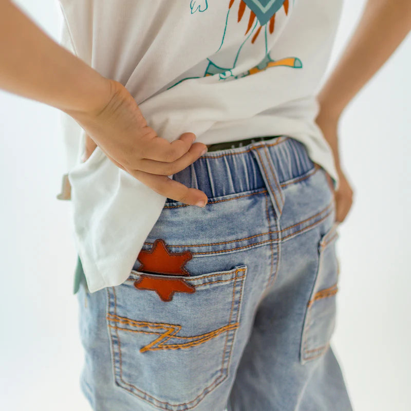 Pale blue jeans with star patch, child