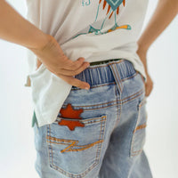 Pale blue jeans with star patch, child
