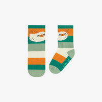 GREEN SOCKS WITH STRIPES AND A PUPPY, BABY