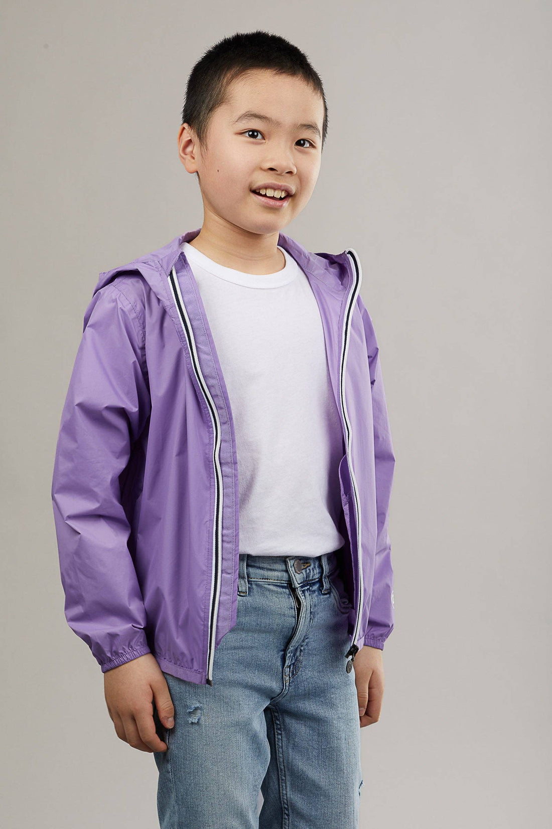 Kids light purple full zip packable rain jacket and windbreaker